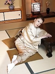 An unattractive Chinese woman is posing without any clothing